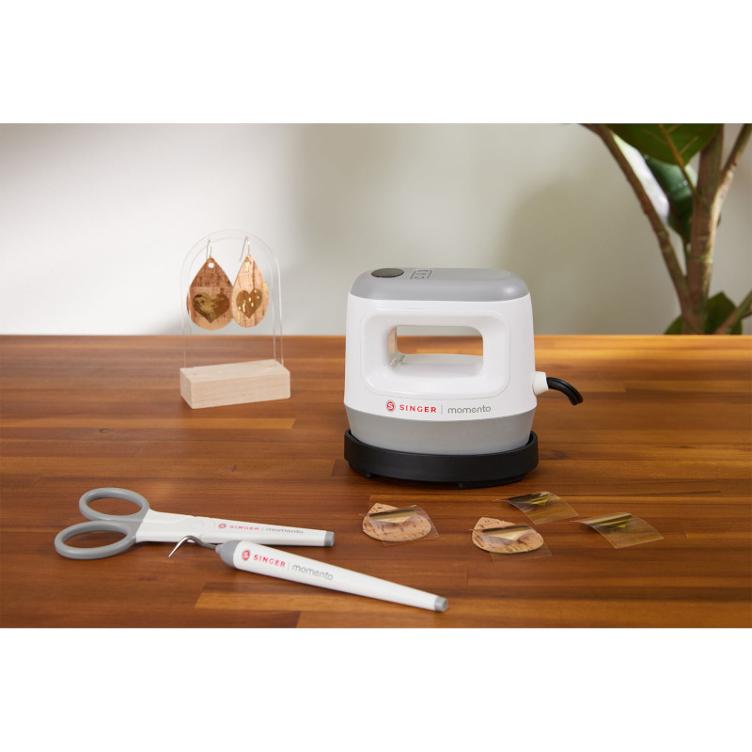 SINGER | momento mini Presse